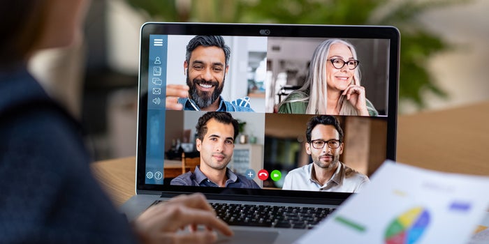 laptop screen showing people on a video call